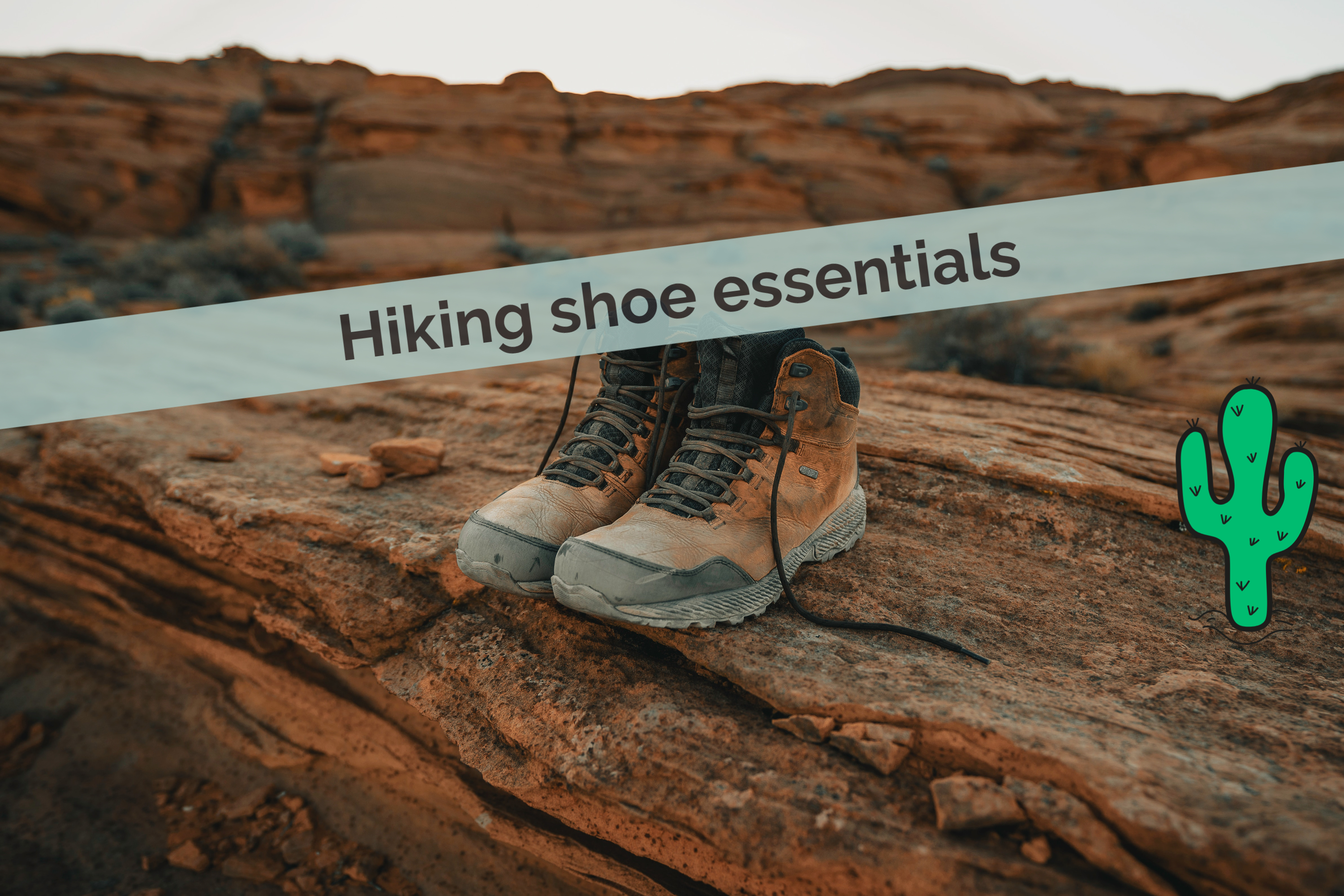 Worn hiking boots rest on a rocky, desert landscape with rugged, brown textures and a serene, earthy backdrop under a pale sky.